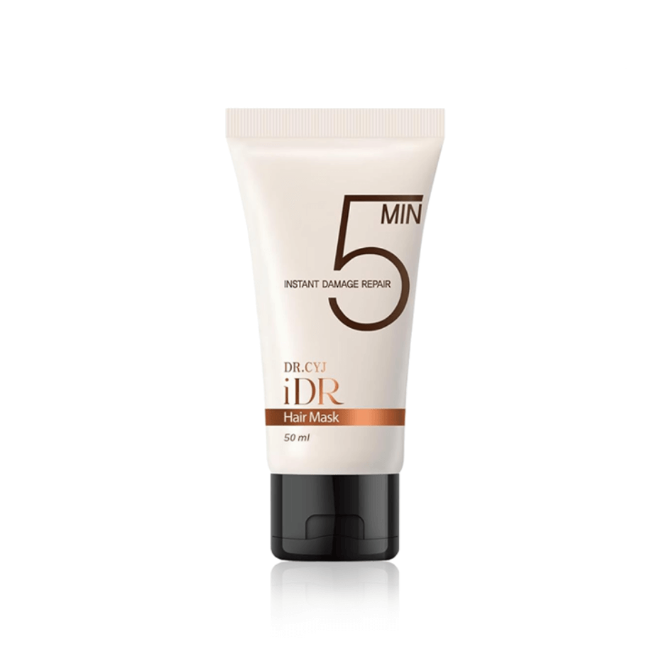 100 ml tube of Dr. CYJ iDR Hair Mask, larger size, with detailed 'Instant Damage Repair' labeling, white and orange design against a dark backdrop.