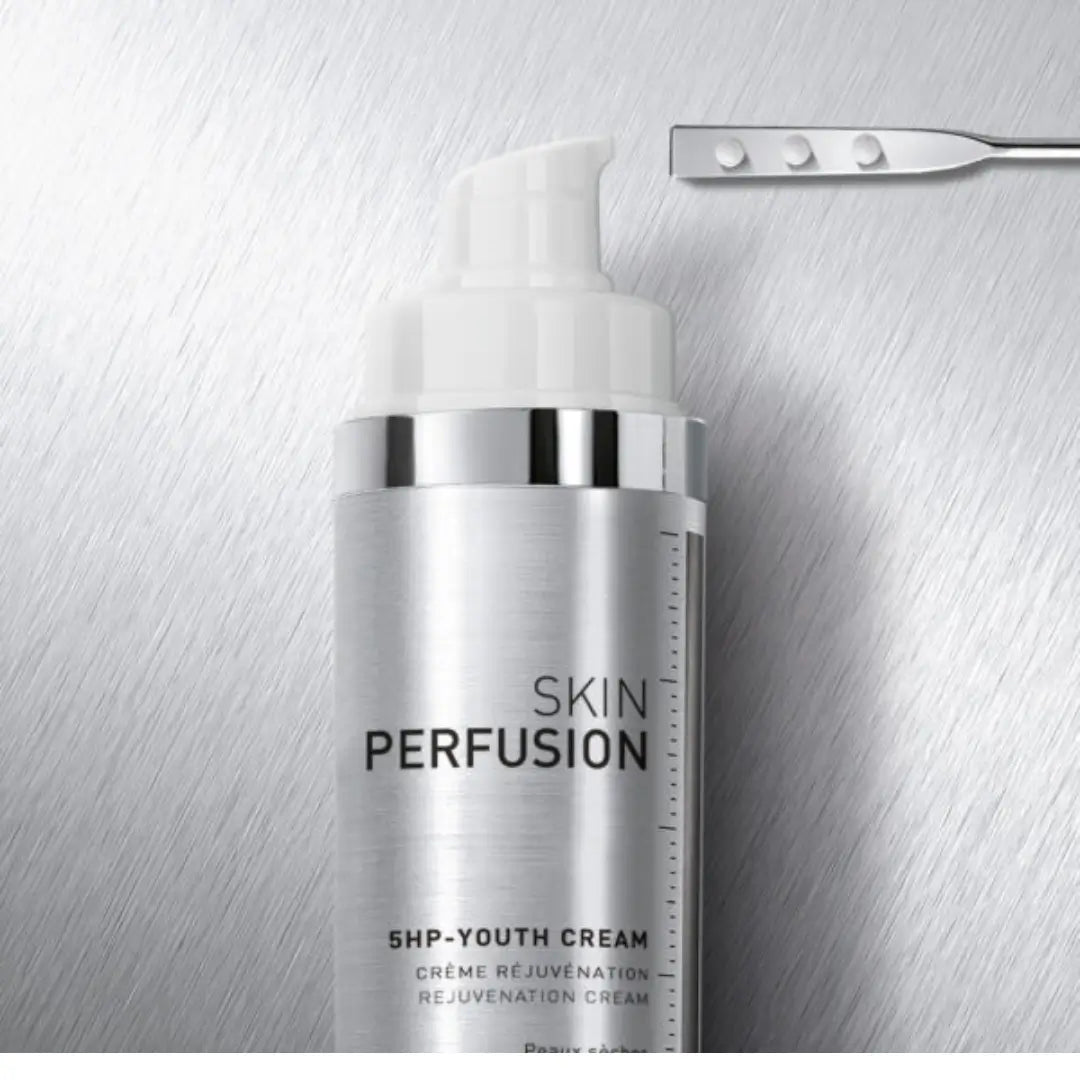 Fillmed Skin Perfusion 5HP Youth Cream 50ml bottle on metallic background, hydrating cream for normal to dry skin with Vitamin B5 and hydroxyproline.
