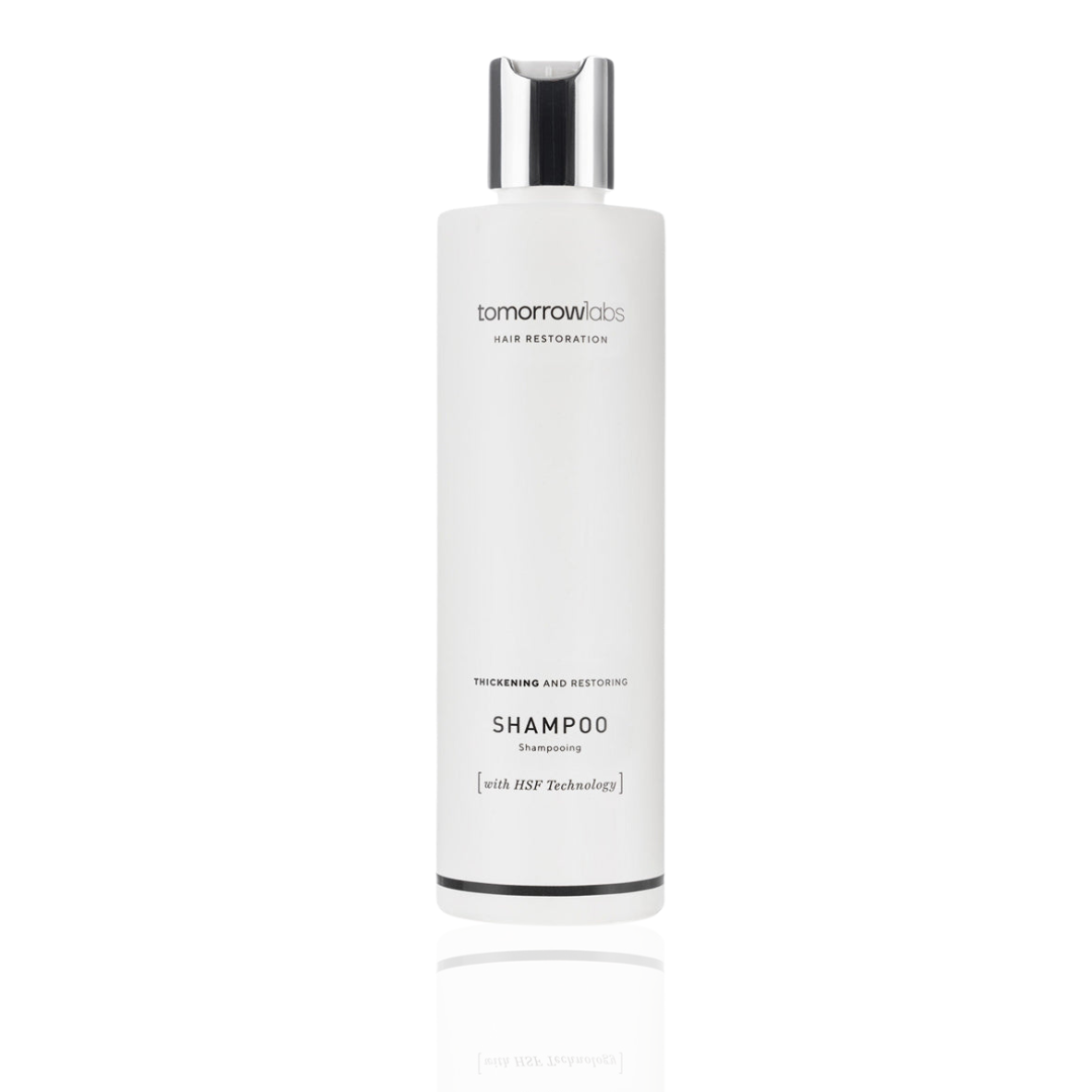 White bottle of Tomorrowlabs Thickening And Restoring Shampoo 250ML with silver cap.